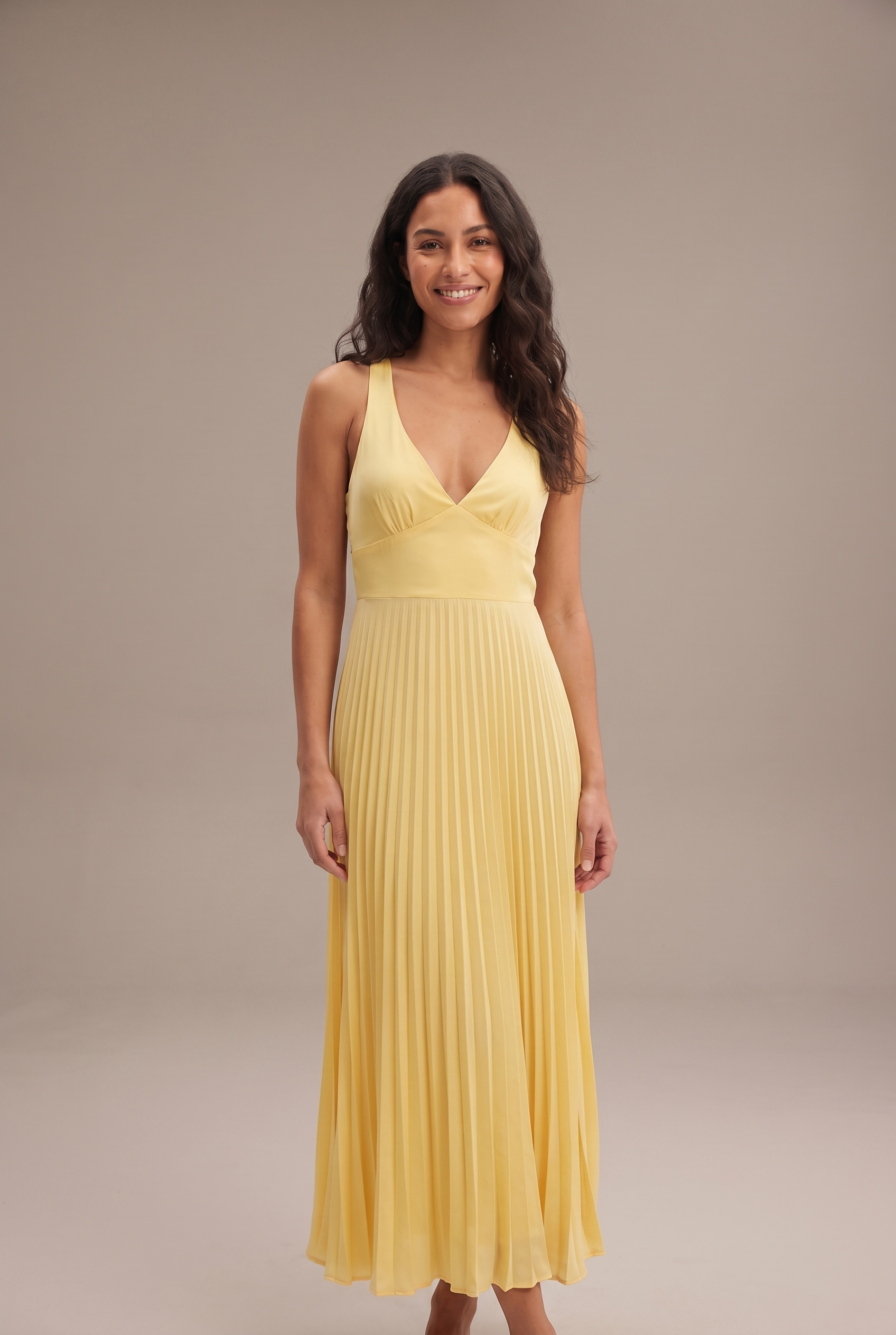 Dorvelli Pleated Cross-Back Maxi in Yellow – front